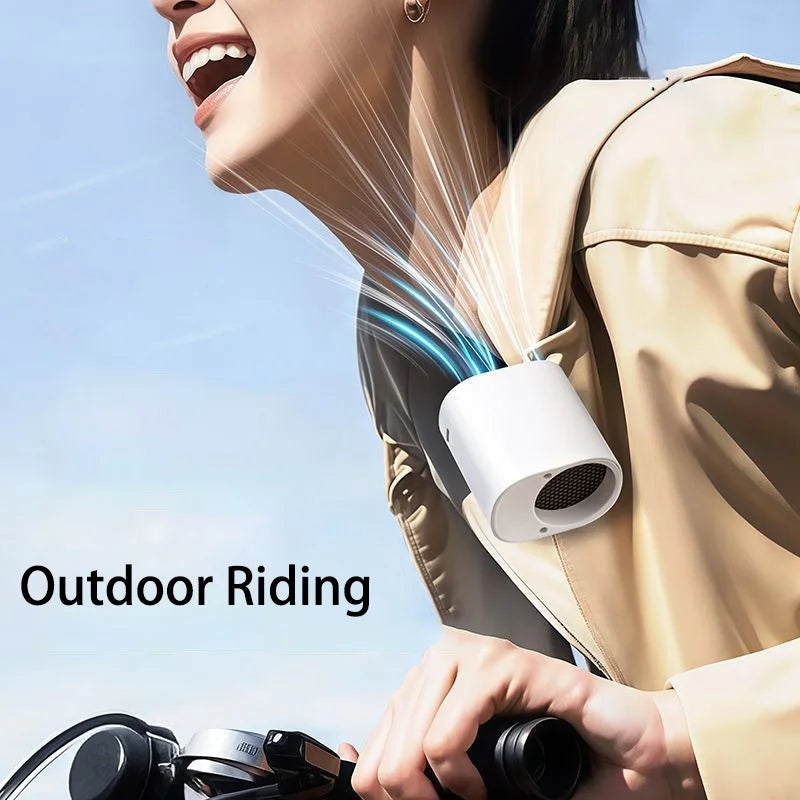 Hipacool portable clip fan attached to jacket of woman riding a bicycle.